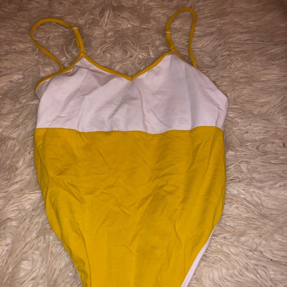 Yellow and white body suit